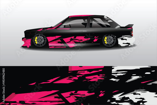 Sleek black car with vibrant pink graphics in motion