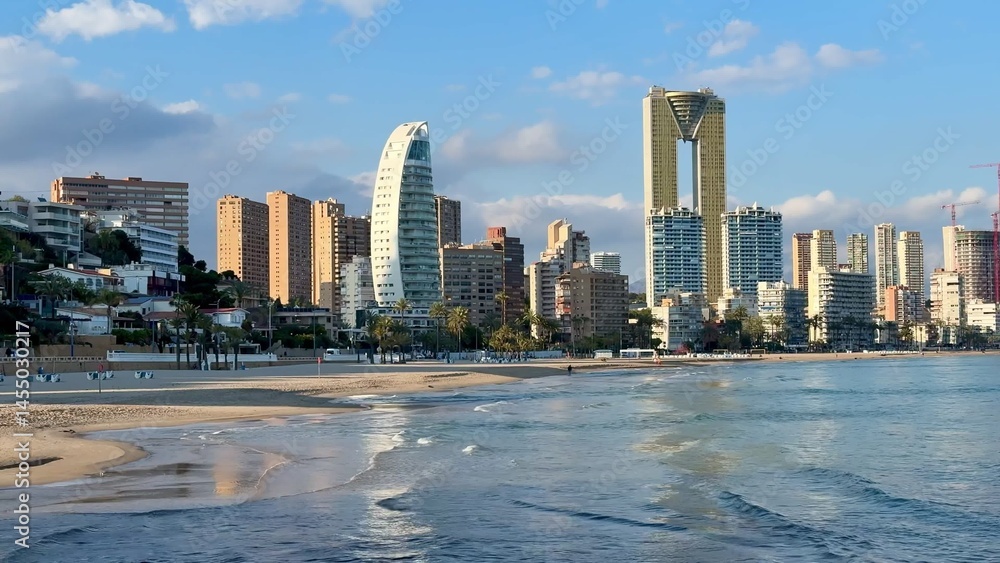 Fototapeta premium Experience the stunning seaside skyline of Benidorm, Spain, showcasing a beautiful waterscape
