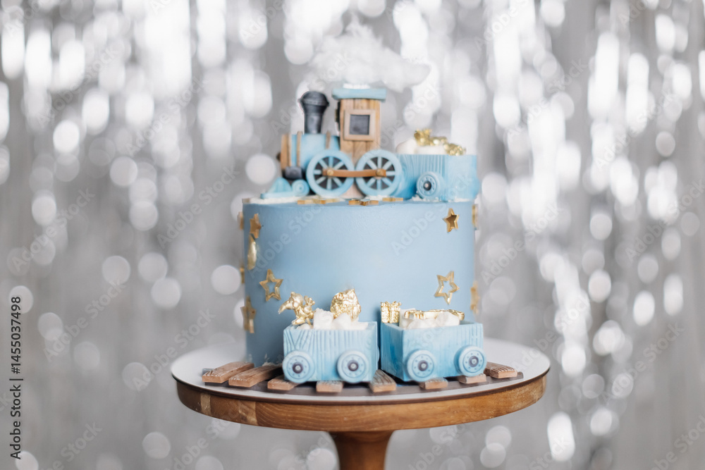 Cake for a children's birthday celebration with trains. Blue birthday cake. Cute sweet dessert with trains for the birthday boy.
