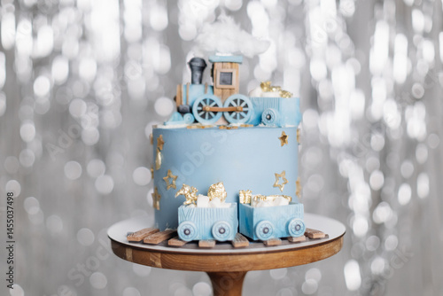 Obraz na płótnie Cake for a children's birthday celebration with trains. Blue birthday cake. Cute sweet dessert with trains for the birthday boy. w salonie