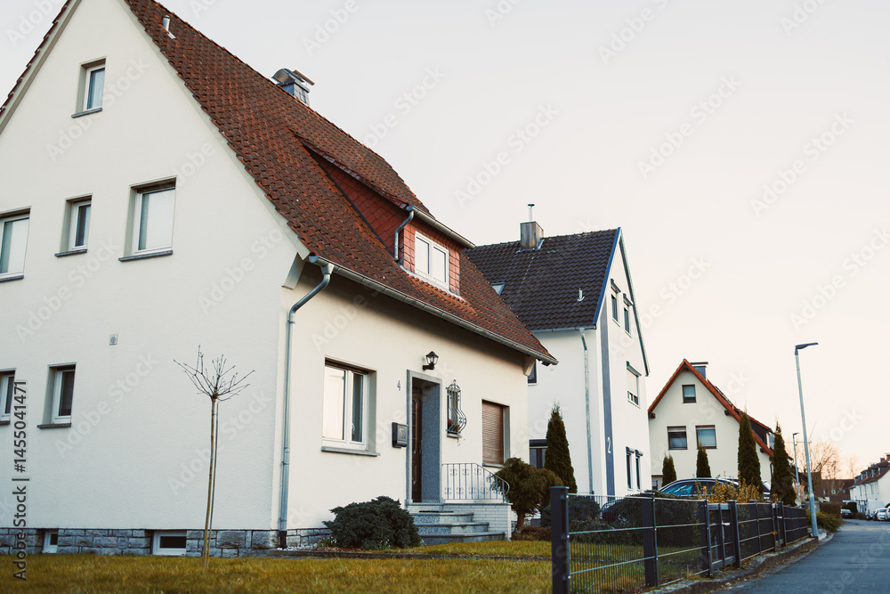 Exterior facade of the house. Landscape design of the house area. European house. Roof on the house made of tiles.