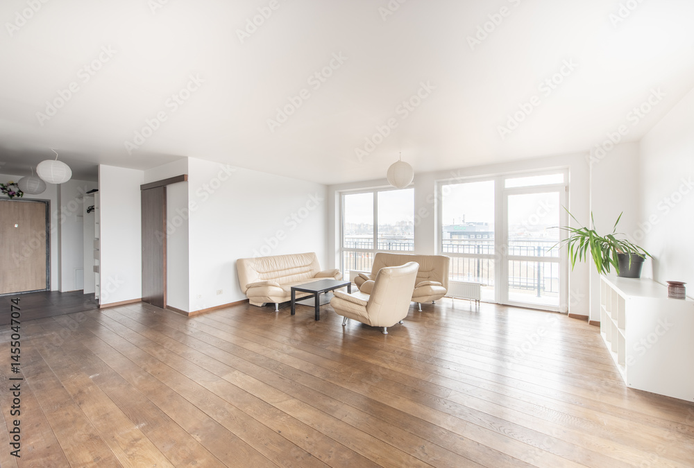 Fototapeta premium Bright Modern Home Living Room Interior With Large Windows And Wooden Floor