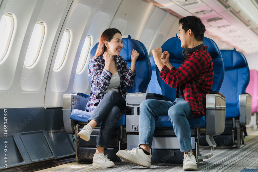 Excited Couple Traveling by Airplane