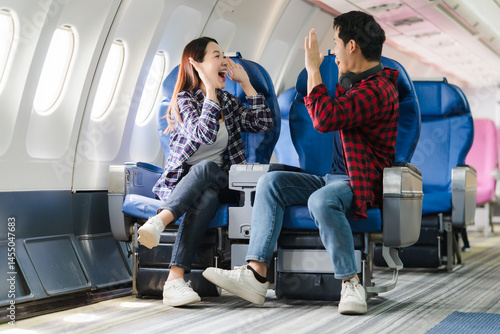 Excited Couple Traveling by Airplane