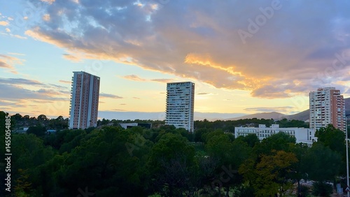 Wallpaper Mural A Stunning Urban Sunset Over a Beautiful Cityscape Showcasing Dramatic and Colorful Clouds Torontodigital.ca