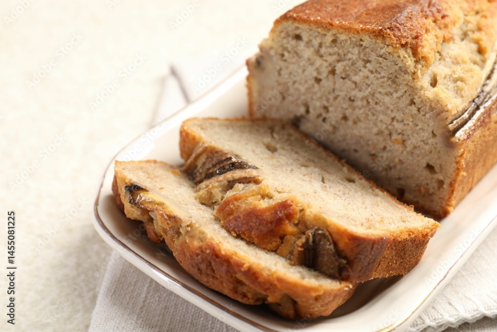 Pieces of banana bread on light grey table, closeup Pieces of banana bread on light grey table, closeup