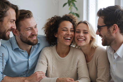 Obraz na płótnie A diverse group of friends enjoying a joyful moment together, sharing laughter and happiness in a cozy setting. w salonie