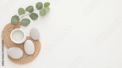 Minimal Spa Flat Lay with Stones, Leaf, and White Cup
