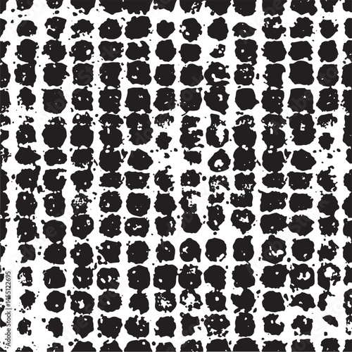 A dense repeating of black circular shapes on a white background.