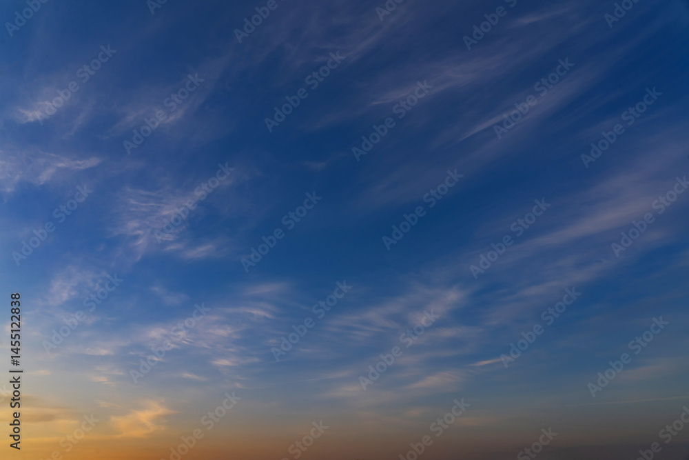Obraz premium summer evening, sunset in yellow, orange and pink with clouds, background