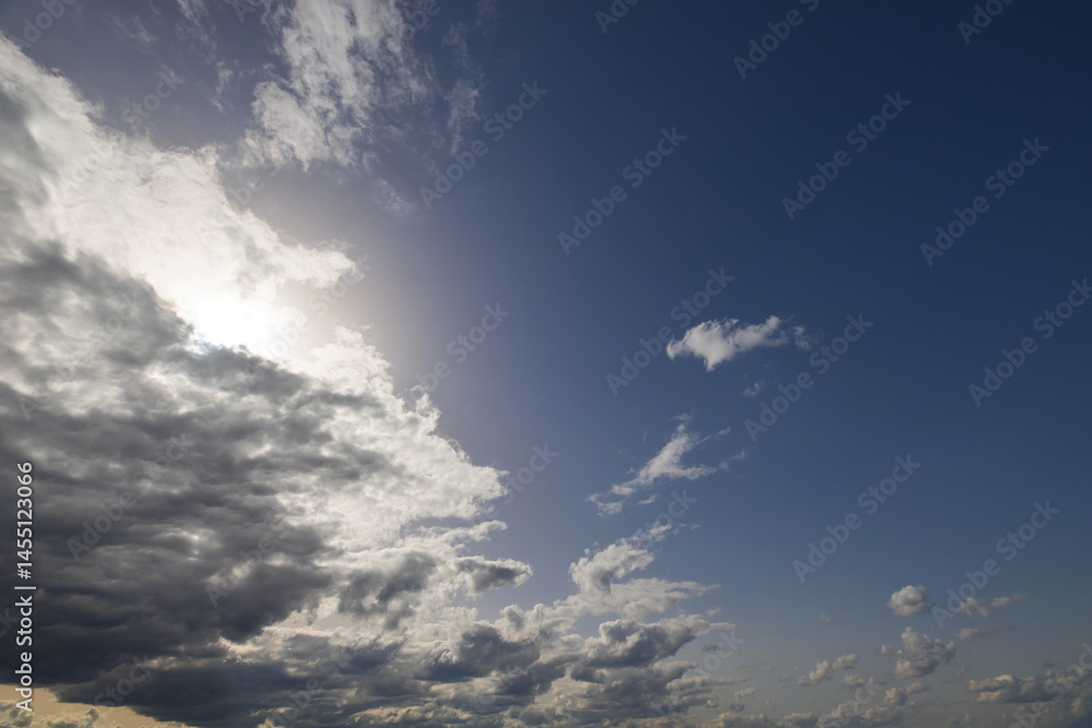 Obraz premium summer evening, sunset in yellow, orange and pink with clouds, background
