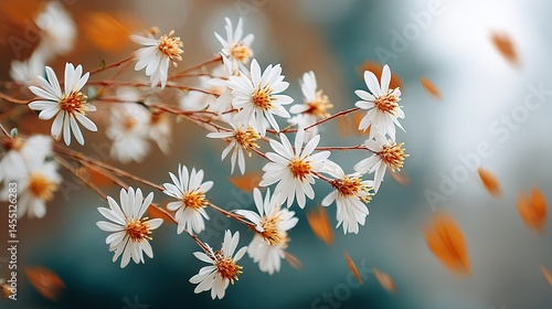   A zoomed-in image of several white blossoms on a bush against an out-of-focus backdrop featuring shades of orange and white flowers