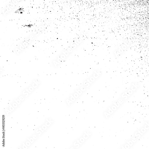 A grayscale depicts a blurred speckled surface with scattered white dots.