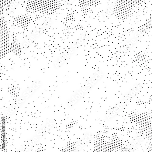 A densely patterned surface displays numerous small dark dots scattered across a white background.