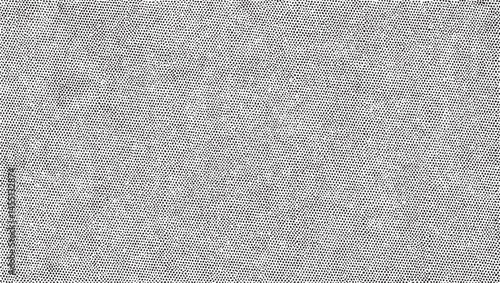 A vast expanse of tightly woven grey fabric stretches across the frame.