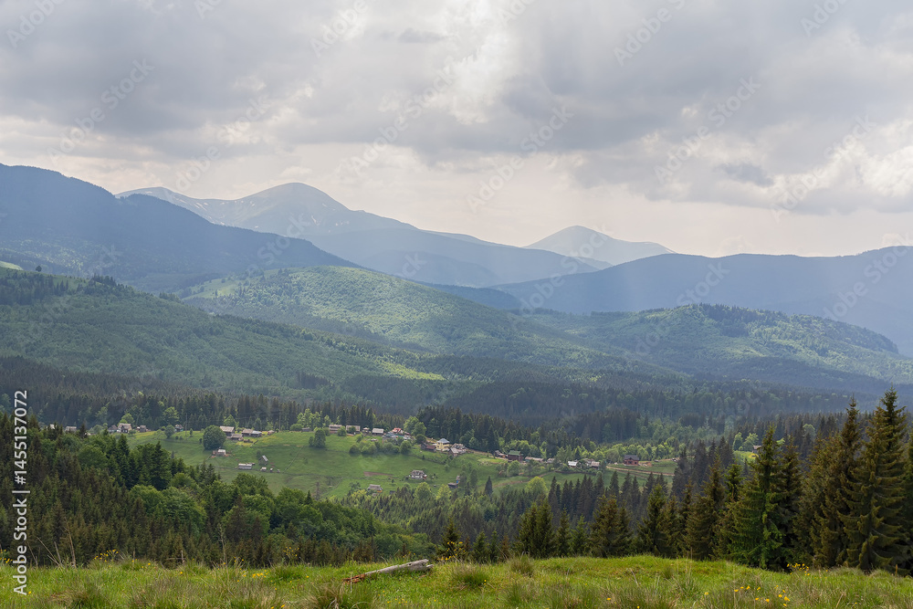 Fototapeta premium Picturesque landscape with village in the Carpathian mountains