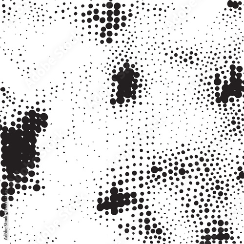 A dense arrangement of dark dots forms subtle ambiguous shapes on a white background.