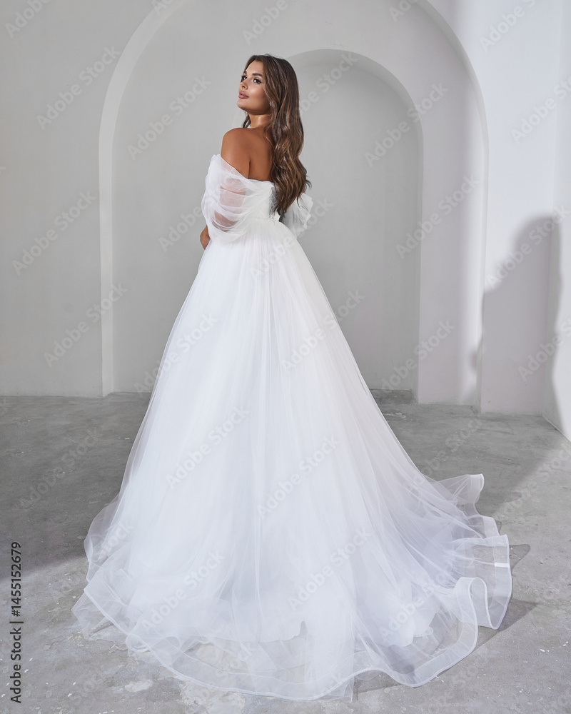 Fototapeta premium Elegant Bride in White Wedding Gown