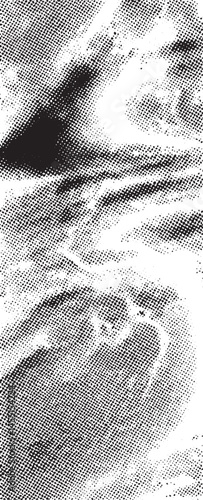A grayscale portrait captures a contemplative individual gazing intensely at the viewer.