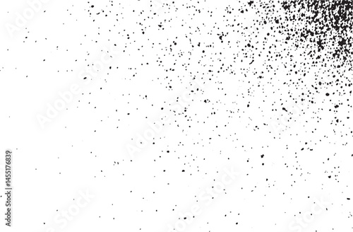 A dense collection of small scattered white dots contrasts sharply against a deep black background.
