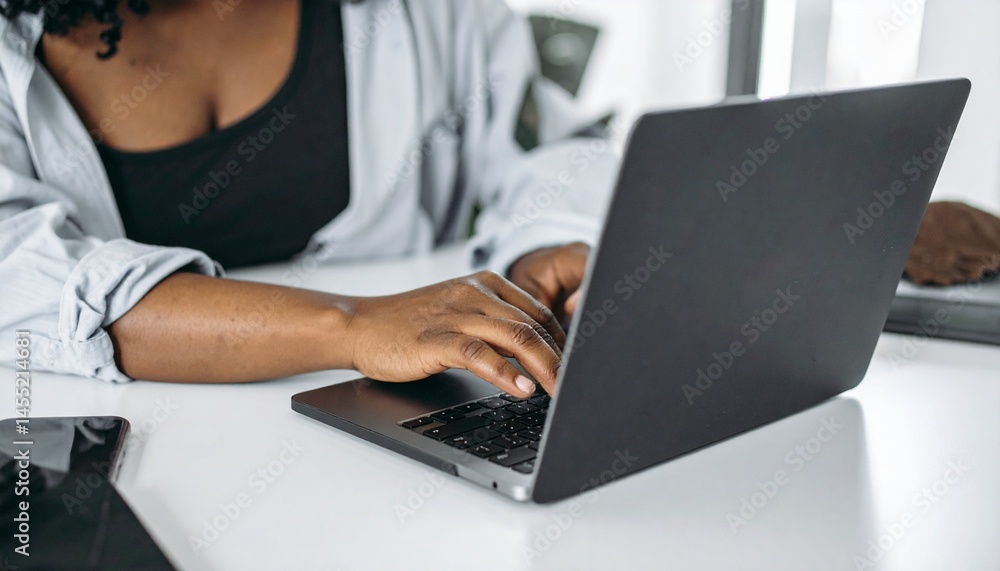 Person analyzing stock charts on laptop at desk Person analyzing stock charts on laptop at desk