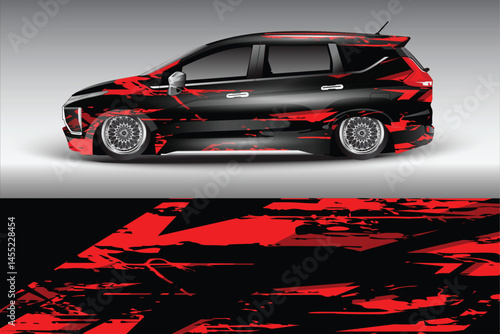 Sleek black car with red graphics in urban setting