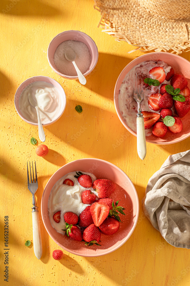 Fresh and sweet strawberries served in summer sunny day.