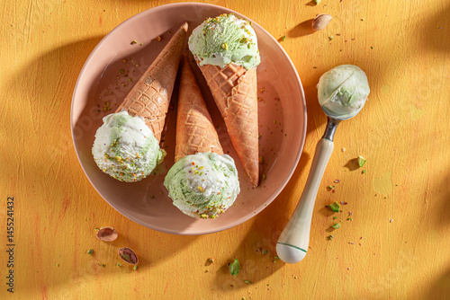 Obraz na płótnie Fresh and tasty pistachio ice cream made of green nuts. w salonie