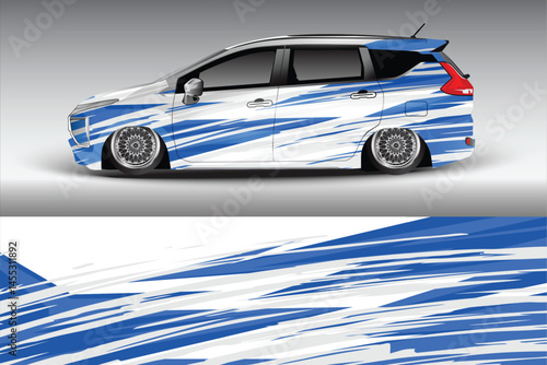 Stylish modified car with blue graphics on display