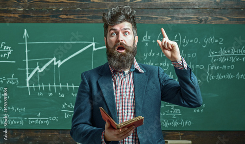Obraz na płótnie Teacher explains math. Professor in classroom on math lesson. School teacher near formula. Funny teacher. Professor teaching lesson. Teacher explains math. Teachers day. Knowledge and education. w salonie