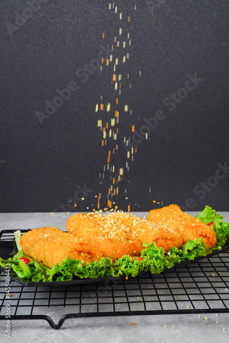Indonesian snack named Risol or Risoles filled with smoked beef mayonnaise and crispy fried bread crumb texture, served on wooden cutting board