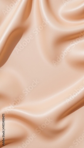 A beautifully draped piece of peach colored silk fabric creates soft folds and curves, providing a luxurious and elegant background for various designs.