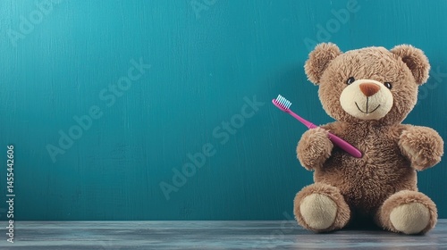 Soft toy bear holding a toothbrush.