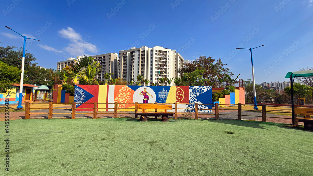 Sitting place at garden with Indian Painting in the wall Sitting place at garden with Indian Painting in the wall