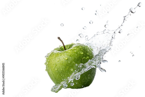 A vibrant green apple glistening with water droplets against a stark black background with water splash