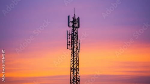 Wallpaper Mural Telecommunication Tower Stands Against a Vibrant Sunset Sky Showcasing Shades of Orange, Pink, and Purple at Dusk in an Urban Setting Torontodigital.ca