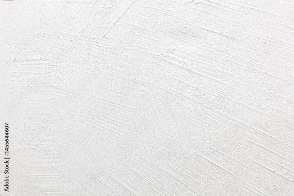 A white wall with a brush stroke pattern A white wall with a brush stroke pattern