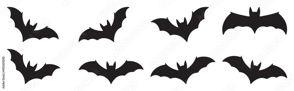 Naklejka premium Set of bat silhouettes in various flying poses, isolated on white background for Halloween or nature themes 