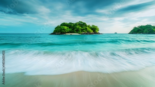 A lush green island surrounded by turquoise ocean water and white sand