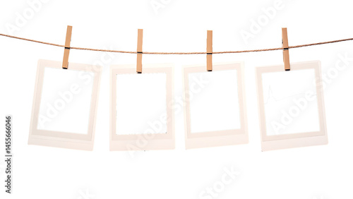 blank polaroid photo frames hanging on clothesline on transparent background PNG