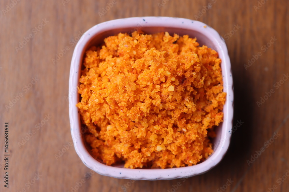 Dry garlic chutney made from red chilly and dry coconut, peanuts and sesame, Indian food, sesoning served with various dishes Dry garlic chutney made from red chilly and dry coconut, peanuts and sesame, Indian food, sesoning served with various dishes