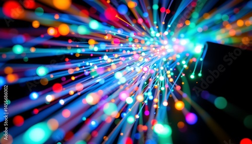 a stock photo of fiber optics, featuring glowing strands of light in vibrant blues, greens, and reds