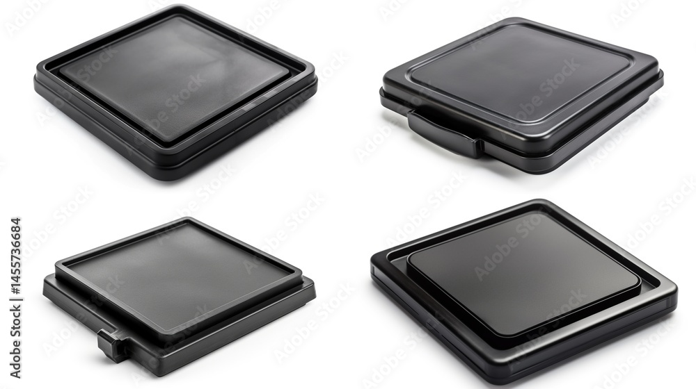 Four black square plastic lids, various angles Four black square plastic lids, various angles