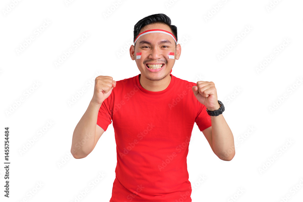 Fototapeta premium Excited young Asian man celebrating Indonesian independence day standing while raising fist isolated on transparent background