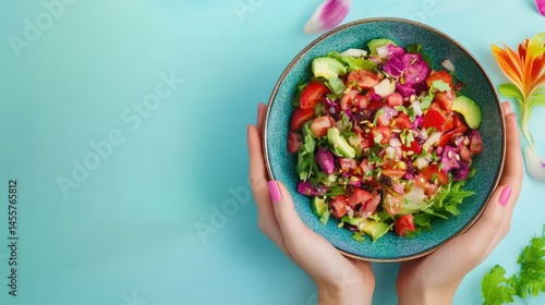 Womans hands holding colorful salad bowl over blank surface, healthy lifestyle concept, ready for text or inscriptions