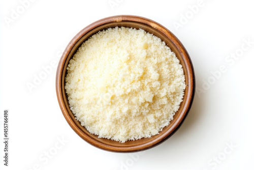 Grated parmesan cheese in brown bowl isolated white background top food meal view dairy tasty recipe