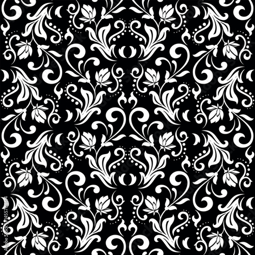 Wallpaper in the style of Baroque. White and black floral ornament. Seamless vector background. Graphic pattern for fabric, wallpaper, packaging. Ornate Damask flower illustration.