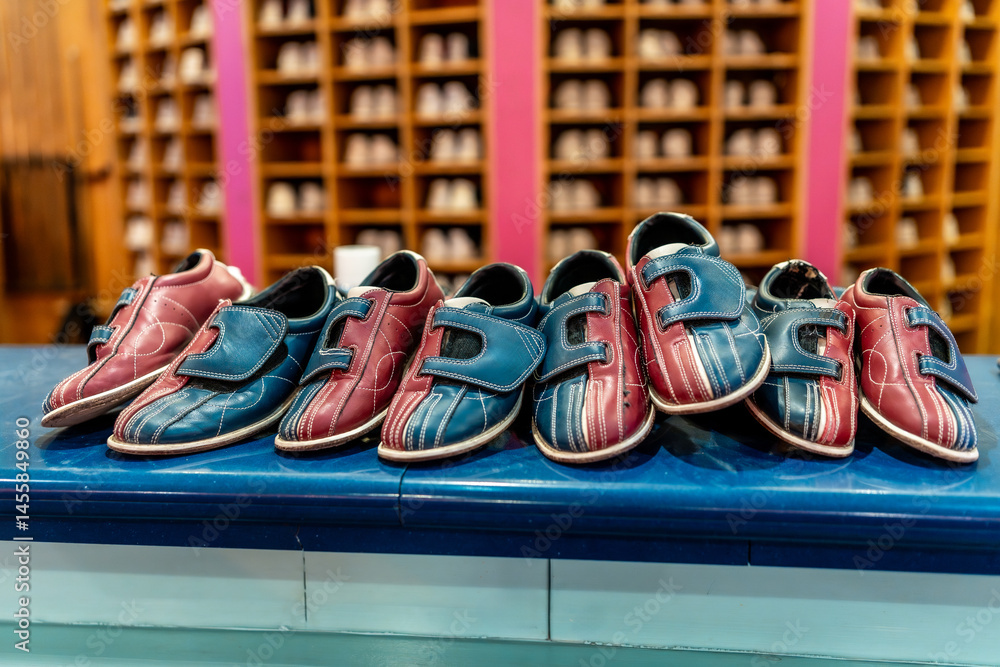 Bowling shoes waiting for bowlers on counter in bowling alley
