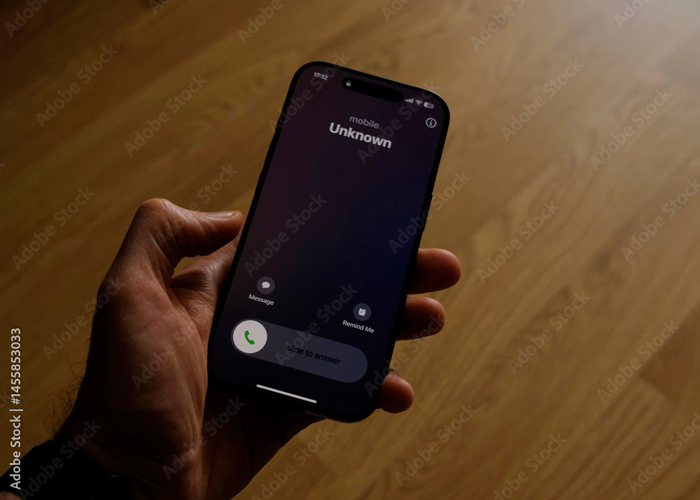 custom made wallpaper toronto digitalFraud or fraudulent schemes. Close-up of a male hand holding a phone with an unexpected incoming call from an unknown