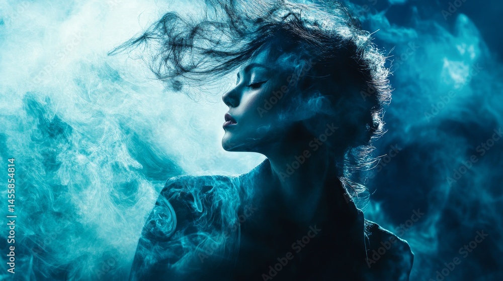 Woman's face illuminated by a blue light with a misty background Woman's face illuminated by a blue light with a misty background